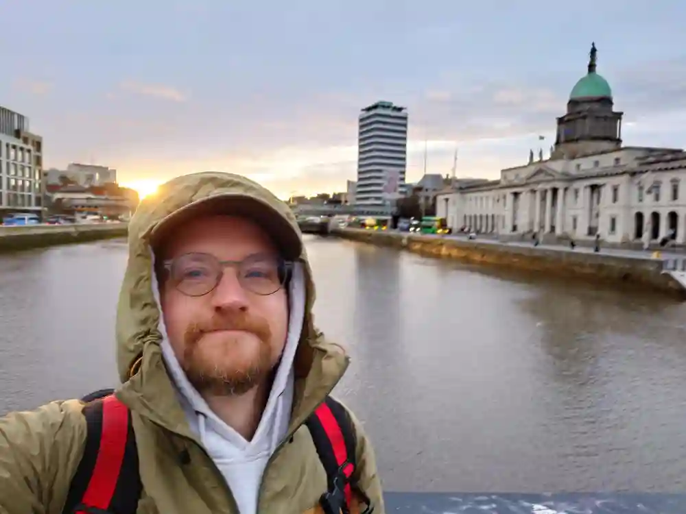 Image: Author on a bridge over the Liffey river in Dublin.