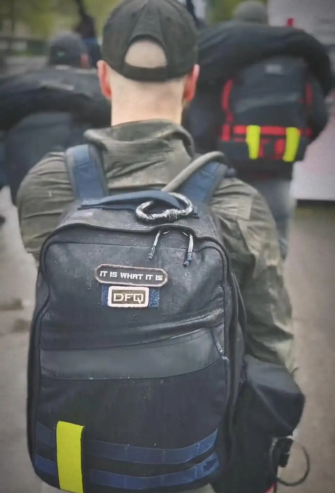 Image: Close-up view on a ruck on a participant's back; ruck with two patches. 