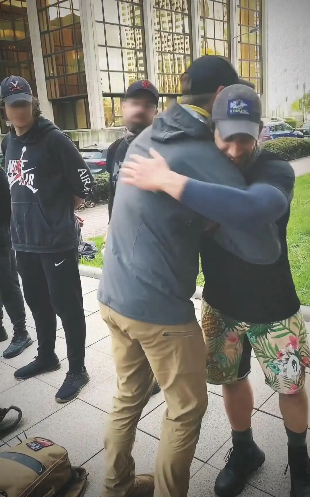 Image: Participant gets patched and is embraced by the event organizer